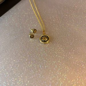 Gold and black flower necklace and studs🌼